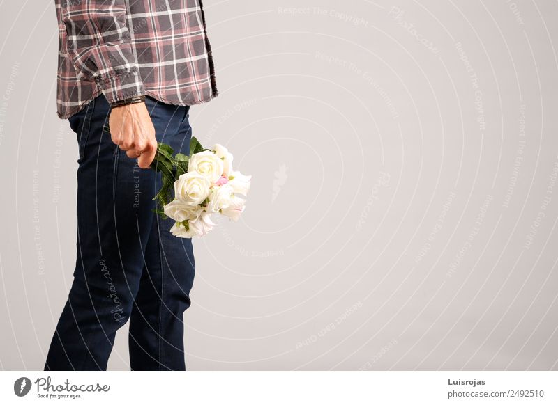 Man in jeans and plaid shirt with some white flowers in his hand Shopping Style Valentine's Day Mother's Day Masculine Adults Hand 1 Human being 18 - 30 years