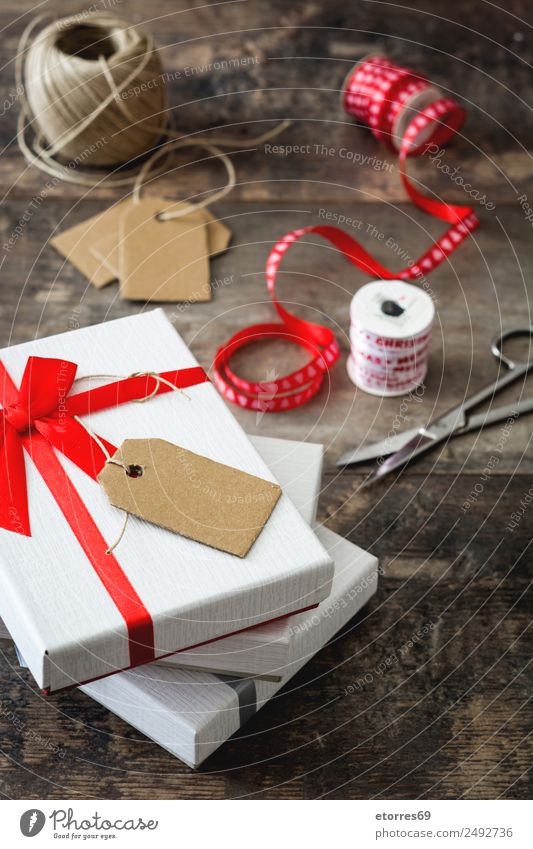 White gift box with label on wooden table. Vacation & Travel Interior design Decoration Feasts & Celebrations Valentine's Day Christmas & Advent Birthday