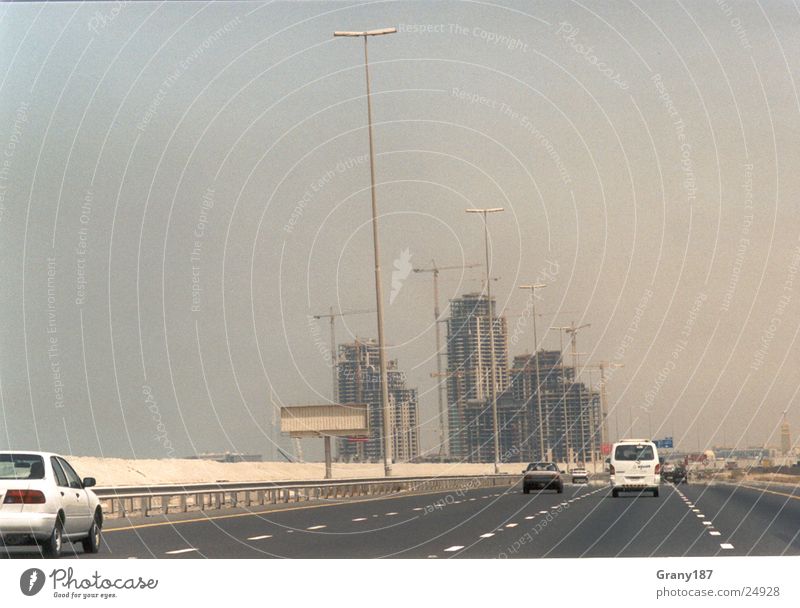 Dubai Boomtown Highway High-rise Construction site Advertising executive Poster Panorama (View) Vacation & Travel Environment Action Success Desert Oil