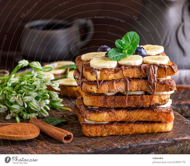 French toast with a banana Fruit Bread Dessert Nutrition Breakfast Flower Wood Eating Fresh Delicious Brown Tradition french Banana chocolate background food