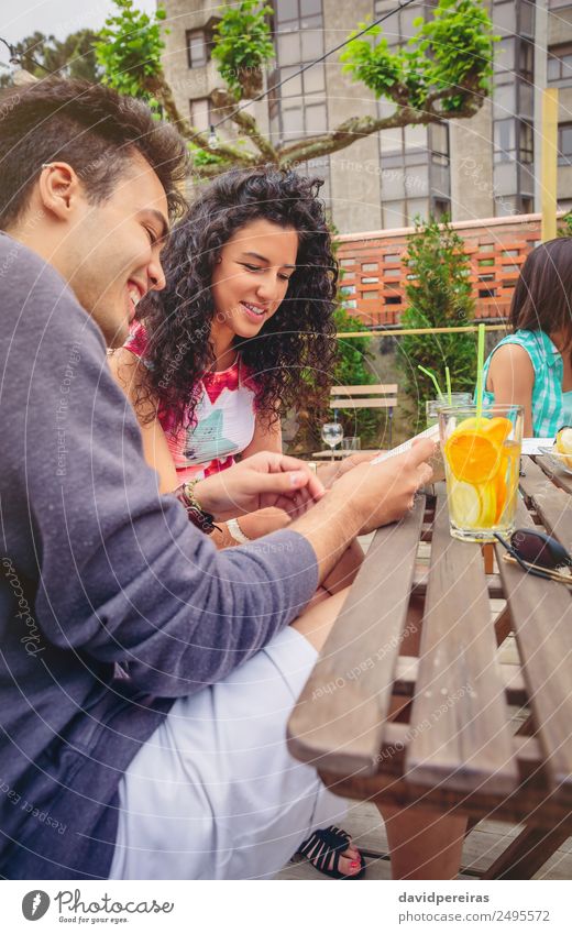 Young couple having fun in a summer day Vegetable Fruit Beverage Lifestyle Joy Happy Beautiful Leisure and hobbies Vacation & Travel Summer Garden Table To talk