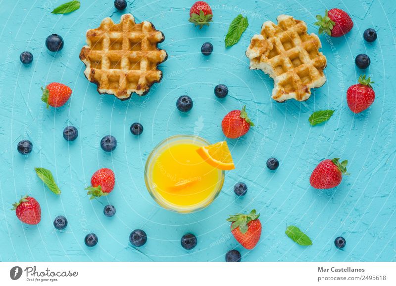 Waffles, red berries, mint leaves and orange juice Fruit Dessert Nutrition Breakfast Lunch Vegetarian diet Diet Lifestyle Summer Table Write Delicious Above