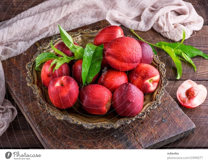 red ripe peaches Fruit Dessert Nutrition Plate Bowl Summer Table Leaf Wood Eating Fresh Above Juicy Brown Green Red Mature Peach Nectarine background food