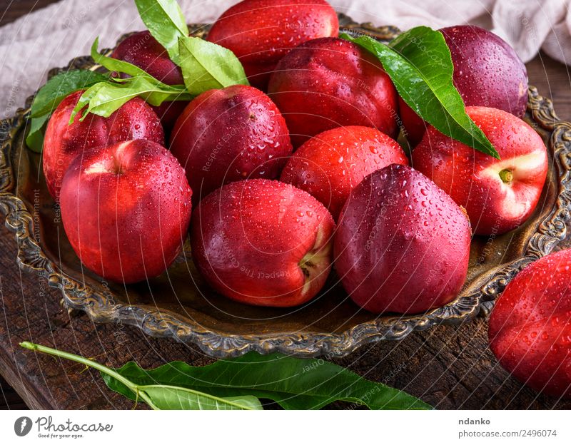red ripe peaches nectarine Fruit Dessert Nutrition Plate Table Eating Fresh Juicy Brown Red Nectarine background food healthy sweet Raw Mature Peach whole Tasty