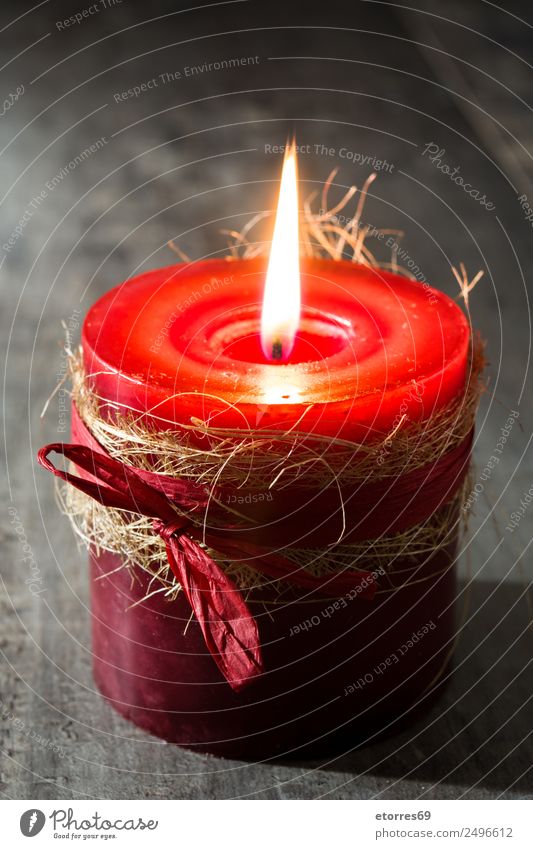 Red candle Christmas & Advent Candle Peaceful Calm Candlelight Light Fire Decoration Holiday season Winter Ornament Wooden table Colour photo Studio shot