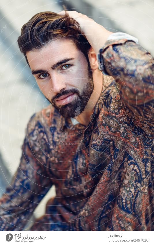 Guy with beard and modern hairstyle in urban background. Lifestyle Style Beautiful Hair and hairstyles Human being Masculine Young man Youth (Young adults) Man