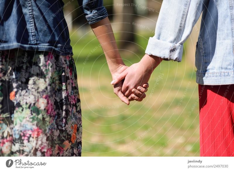 Two young women in walking holding her hands outdoors Lifestyle Joy Happy Beautiful Human being Feminine Young woman Youth (Young adults) Woman Adults
