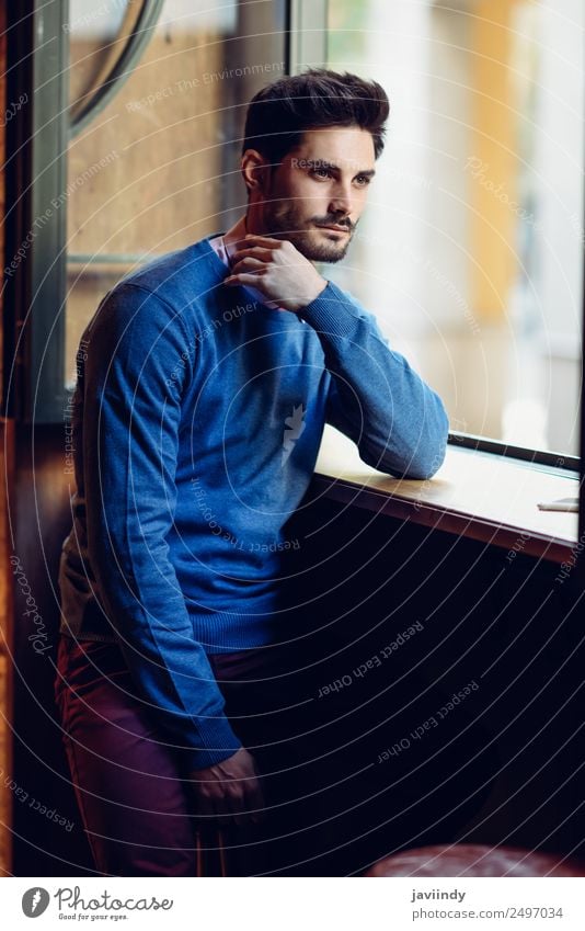 young man with modern hairstyle - a Royalty Free Stock Photo from Photocase