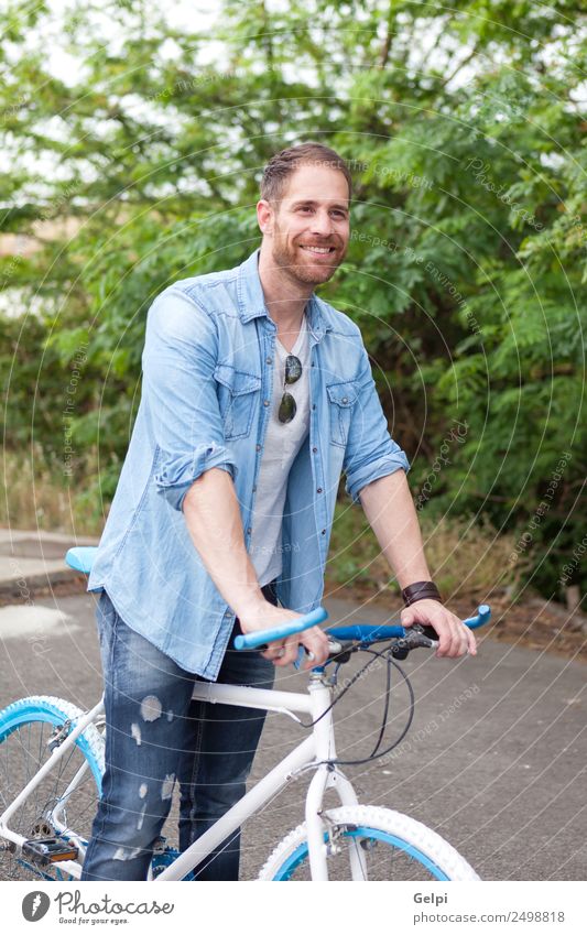 Casual guy Lifestyle Joy Happy Leisure and hobbies Vacation & Travel Summer Sports Cycling Human being Man Adults Nature Park Transport Street To enjoy Smiling