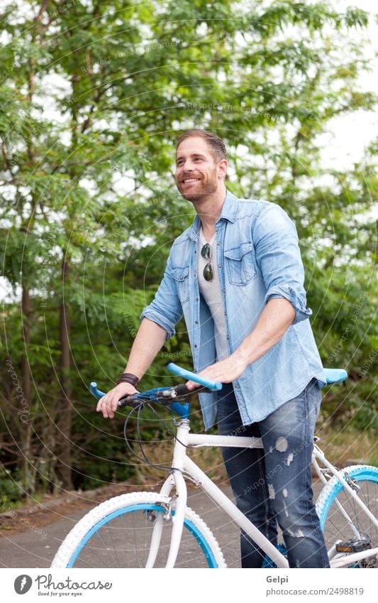 Casual guy Lifestyle Joy Happy Leisure and hobbies Vacation & Travel Summer Sports Cycling Human being Man Adults Nature Park Transport Street To enjoy Smiling