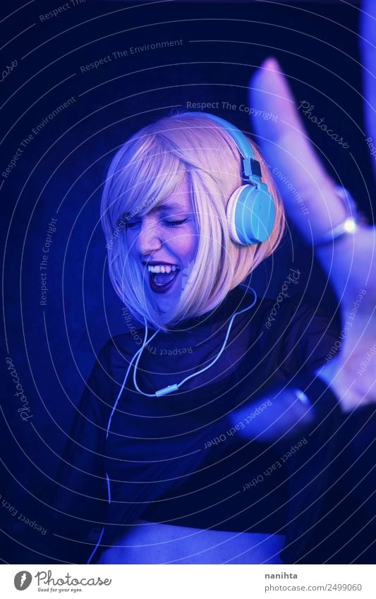 Young DJ woman in a night party Lifestyle Style Joy Night life Entertainment Party Event Music Club Disco Disc jockey Feasts & Celebrations Dance Headset