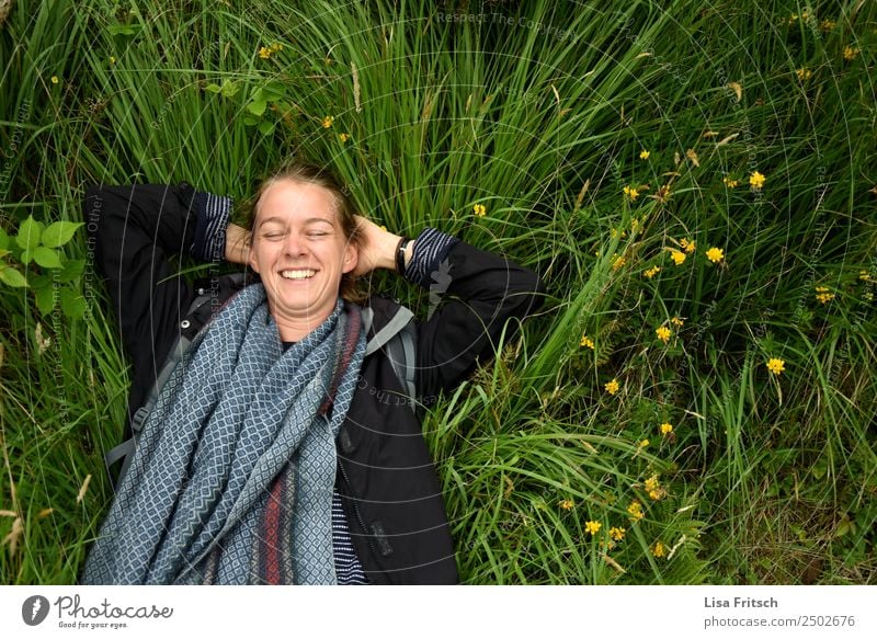 Laughing lying in the grass, eyes closed. Vacation & Travel Tourism Woman Adults 1 Human being 18 - 30 years Youth (Young adults) Nature Flower Grass Meadow