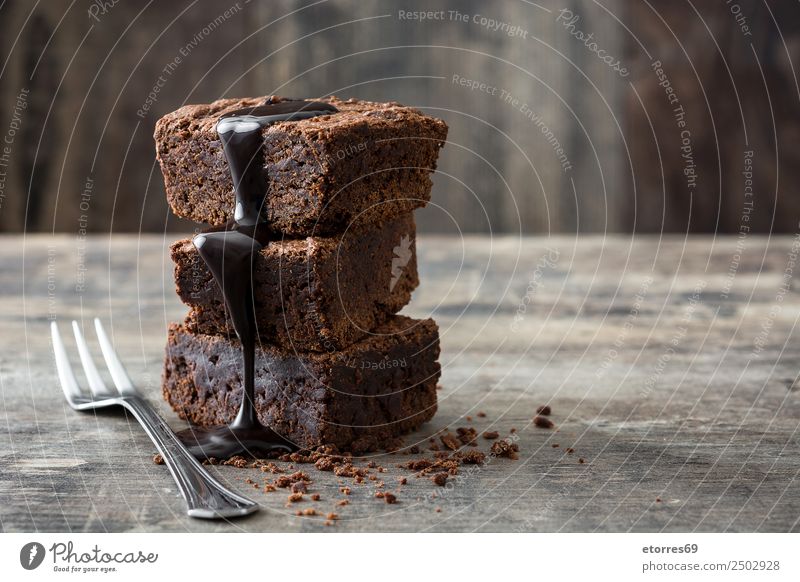 Chocolate brownie portions on wooden background Food Cake Dessert Candy Nutrition Breakfast Lunch Organic produce Vegetarian diet Fork Wood Metal Natural Brown