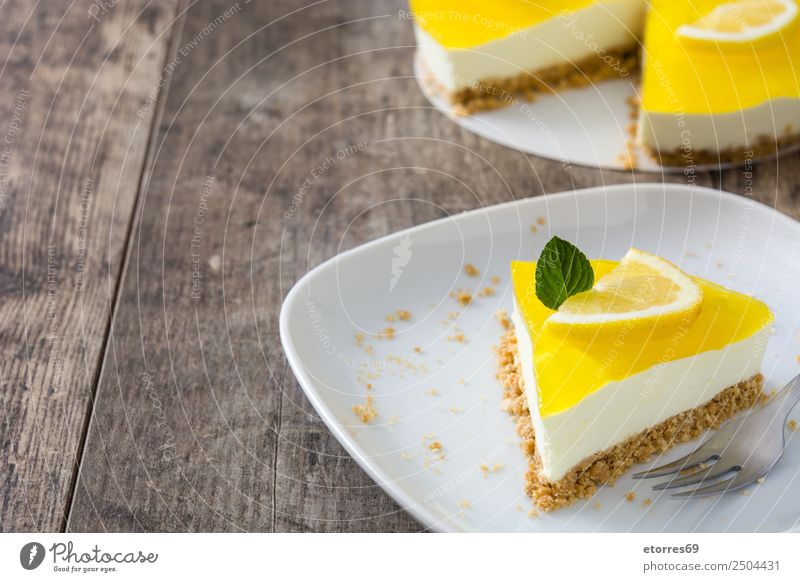 Lemon pie slice on wooden table Food Healthy Eating Food photograph Vegetable Fruit Baked goods Cake Dessert Candy Nutrition Vegetarian diet Yellow Green White