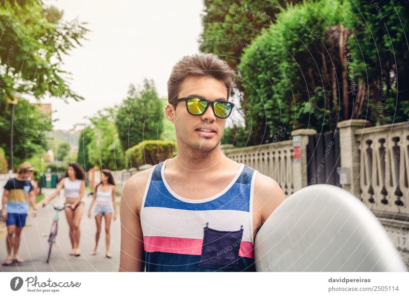 Close up of young man with sunglasses holding surfboard Lifestyle Joy Happy Relaxation Leisure and hobbies Summer Beach Sports Woman Adults Man Friendship