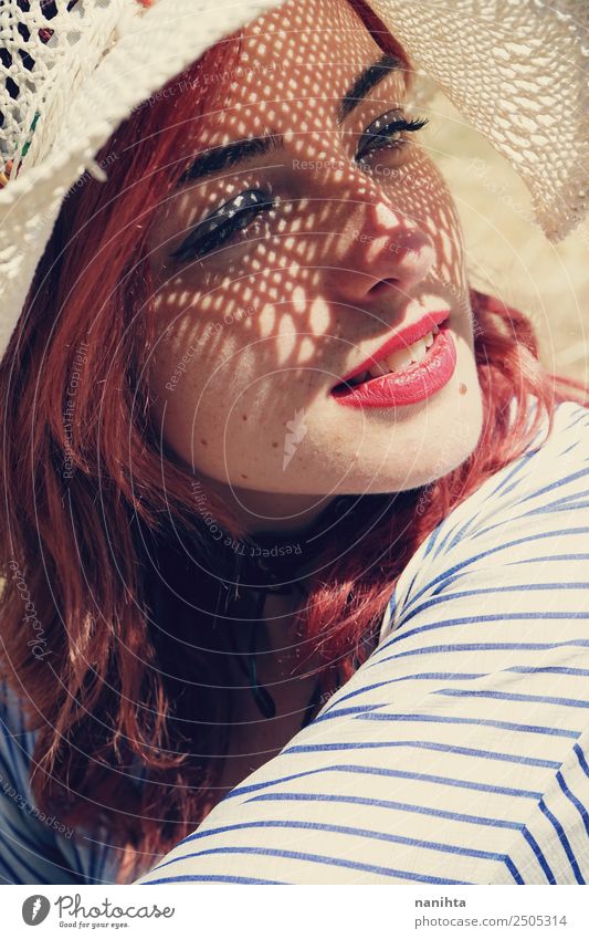 Young woman covering from sun with a hat Lifestyle Elegant Style Wellness Senses Relaxation Vacation & Travel Summer Summer vacation Sun Human being Feminine