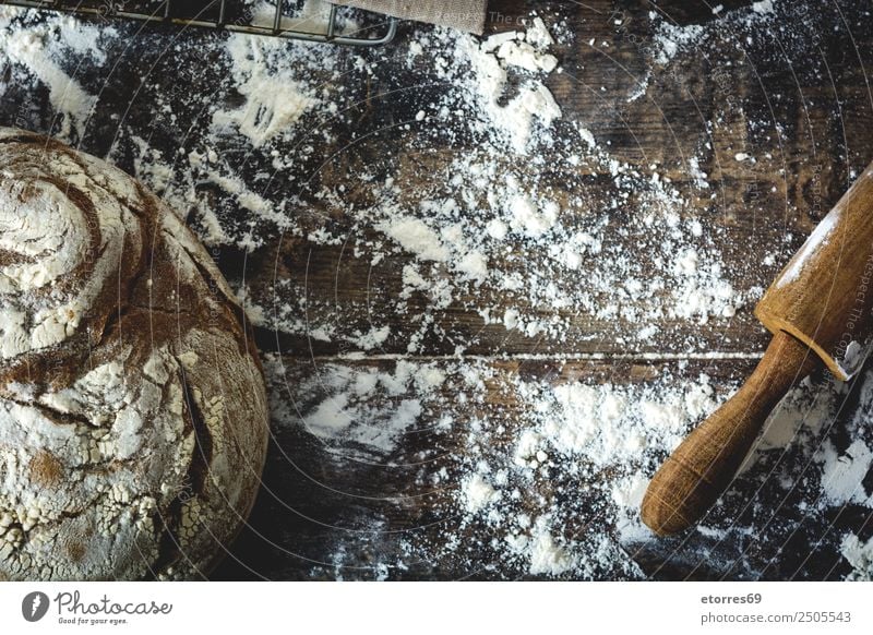 Bread and flour on a rustic wooden background. Make Kitchen Apron Flour Yeast Home-made Baking Dough Preparation Stir Ingredients Wood Neutral Background