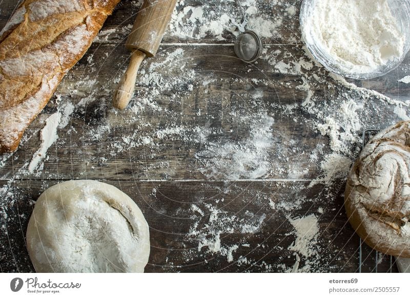 Bread and flour on a rustic wooden background Make Kitchen Apron Flour Yeast Home-made Baking Dough Preparation Stir Ingredients Wood Rustic