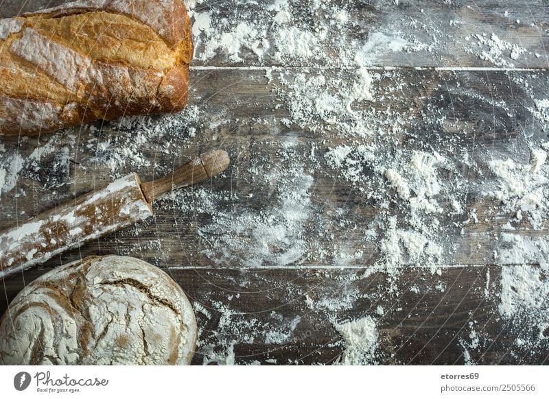 Bread and flour on a rustic wooden background Make Kitchen Apron Flour Yeast Home-made Baking Dough Preparation Stir Ingredients Wood Rustic