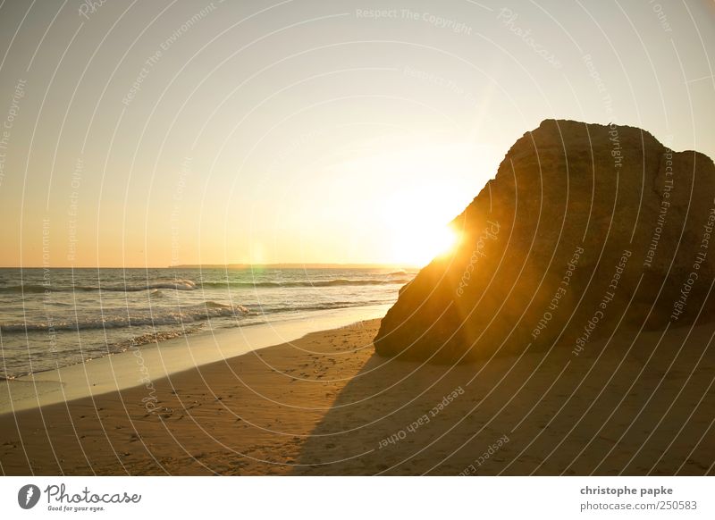 Rock in the surf Summer Summer vacation Beach Ocean Waves Cloudless sky Horizon Sun Sunrise Sunset Sunlight Beautiful weather Coast Portugal Uniqueness