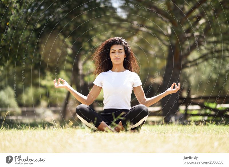 Young Arab woman doing yoga in nature. Lifestyle Hair and hairstyles Relaxation Calm Meditation Sports Yoga Human being Young woman Youth (Young adults) Woman