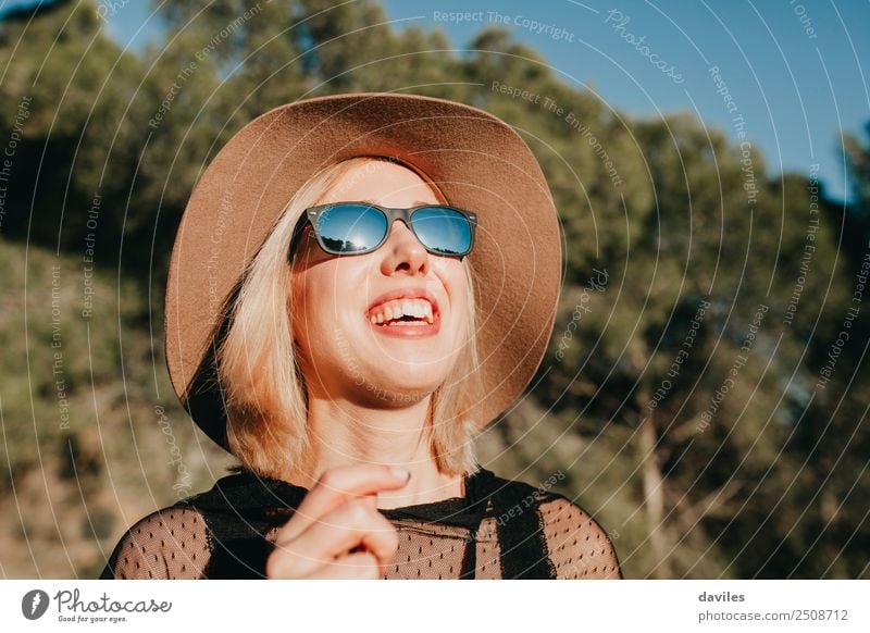 Close up portrait of happy blonde woman enjoying the sun in nature Lifestyle Style Joy Beautiful Face Wellness Relaxation Leisure and hobbies Vacation & Travel