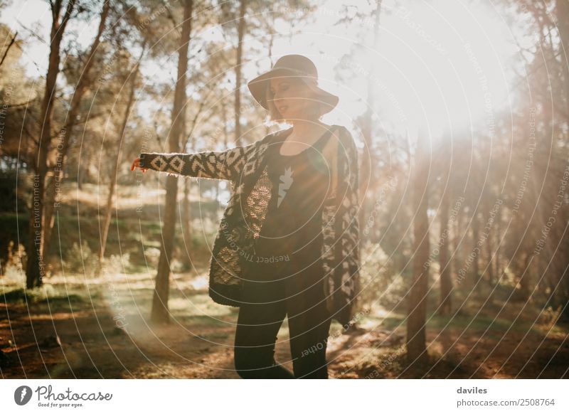 Young woman taking a walk in the forest Lifestyle Joy Leisure and hobbies Vacation & Travel Adventure Freedom Expedition Mountain Hiking Human being Feminine