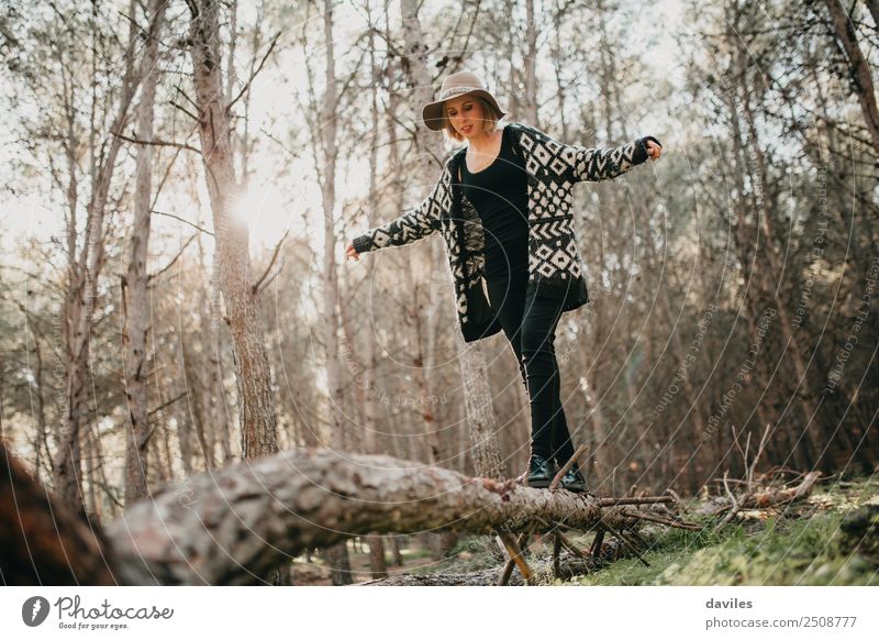 Woman walking on a fallen tree trunk Lifestyle Joy Leisure and hobbies Vacation & Travel Trip Adventure Freedom Mountain Hiking Human being Young woman