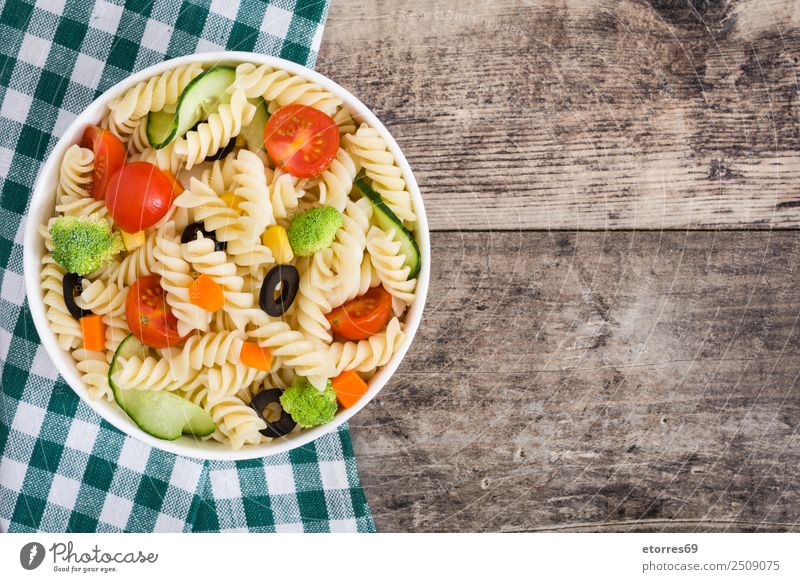 Pasta salad with vegetables in bowl on wood Food Vegetable Lettuce Salad Dough Baked goods Nutrition Lunch Organic produce Vegetarian diet Diet Bowl Wood
