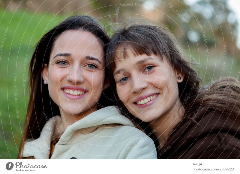 Nice sisters with blue eyes Lifestyle Joy Happy Beautiful Face Human being Woman Adults Sister Family & Relations Friendship Youth (Young adults) Teeth Park