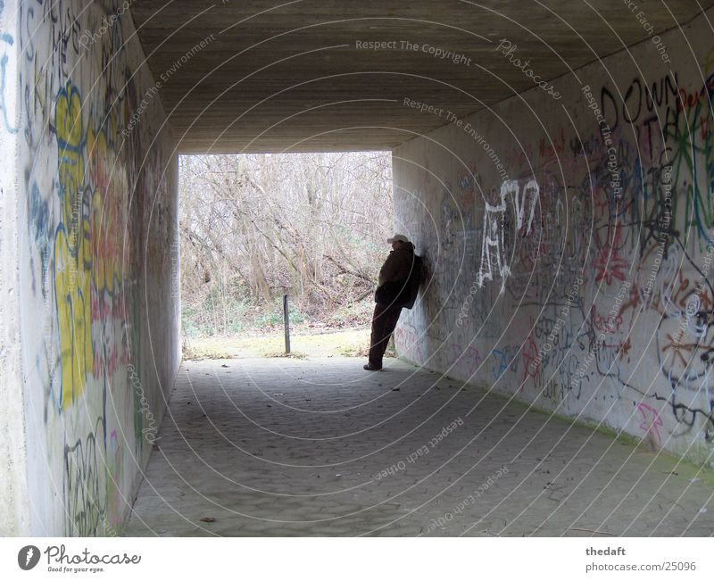 Waiting Loneliness Light Man Tunnel Pedestrian underpass Underpass Human being Shadow graffiti