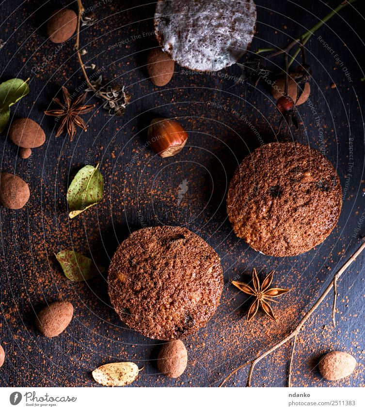 baked muffins on a black table Cake Dessert Candy Breakfast Table Wood Eating Fresh Small Above Brown Black Powder background Baking Bakery chocolate cooking