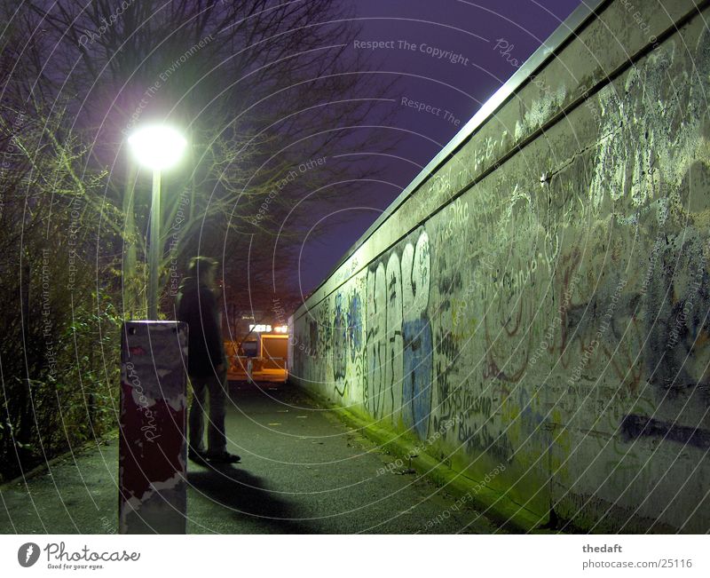 solitariness Wall (barrier) Light Loneliness Night Cold Winter Man Grief Distress Graffiti Human being
