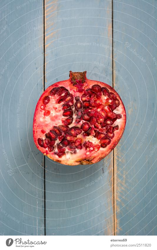 Pomegranate on blue wooden background Fruit Red Food Healthy Eating Food photograph Vegetarian diet Diet Nutrition Organic Raw Fresh Exotic Blue Wood