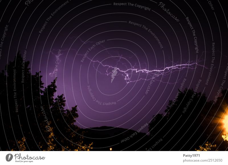 Lightning in a thunderstorm sky Environment Nature Landscape Sky Bad weather Storm Thunder and lightning tree hillock Climate Colour photo Exterior shot