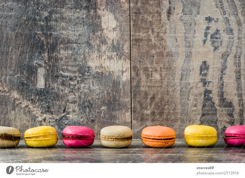 Colored macaroons on rustic wooden background Macaron Sweet Candy Healthy Eating Food photograph Dessert French Delicious Snack Cookie Tradition Pink Wood Tasty