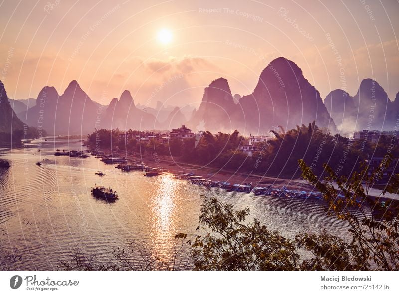 Scenic sunset over Li River in Xingping, China Vacation & Travel Tourism Trip Adventure Freedom Sightseeing Expedition Mountain Hiking Landscape Hill Village