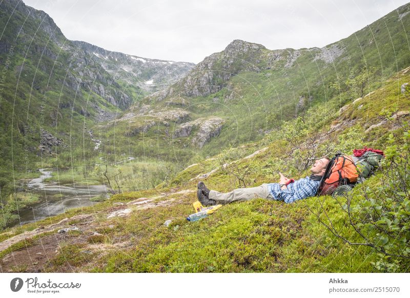 Young man relaxes in nordic landscape Vacation & Travel Adventure Mountain Hiking Human being Youth (Young adults) 1 Nature Canyon River Norway Relaxation