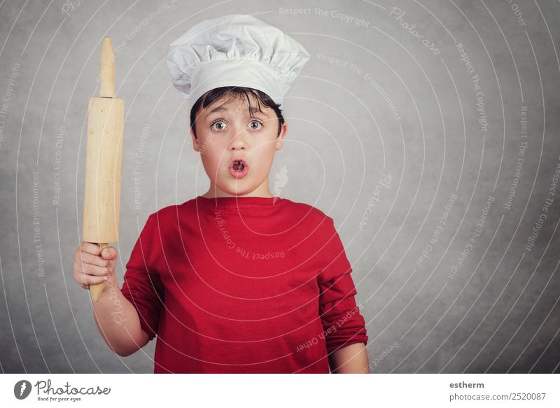 child cook surprised with a rolling pin Food Nutrition Dinner Diet Cutlery Lifestyle Kitchen Restaurant Gastronomy Business Human being Masculine Child
