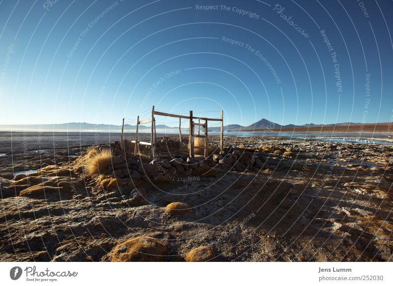 Our House Landscape Cloudless sky Horizon Mountain Lakeside Blue Brown Yellow Gold Bolivia Plain Hut Broken Open Freedom Travel photography Colour photo