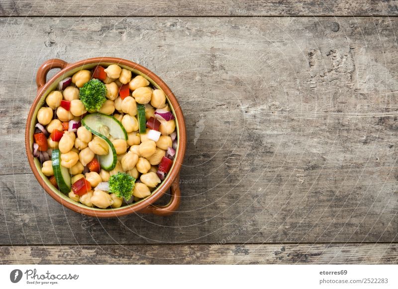 Chickpea salad in brown bowl on wood Food Vegetable Nutrition Lunch Vegetarian diet Diet Healthy Healthy Eating Wood Fresh White Chickpeas Salad Cucumber Onion