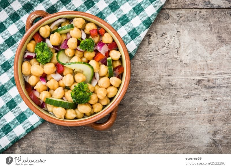 Chickpea salad in bowl on wooden background champagne
 chickpea Salad Cucumber Onion Broccoli Vegetable Vegan diet Vegetarian diet Pepper White Healthy