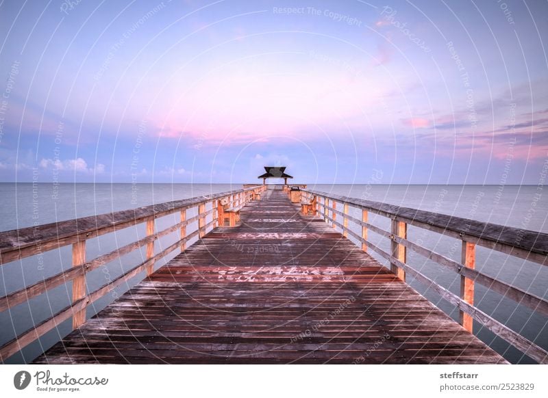 Early sunrise over the Naples Pier Relaxation Vacation & Travel Trip Summer Sun Beach Ocean Waves Nature Landscape Sky Clouds Coast Wood Water Blue Violet Pink