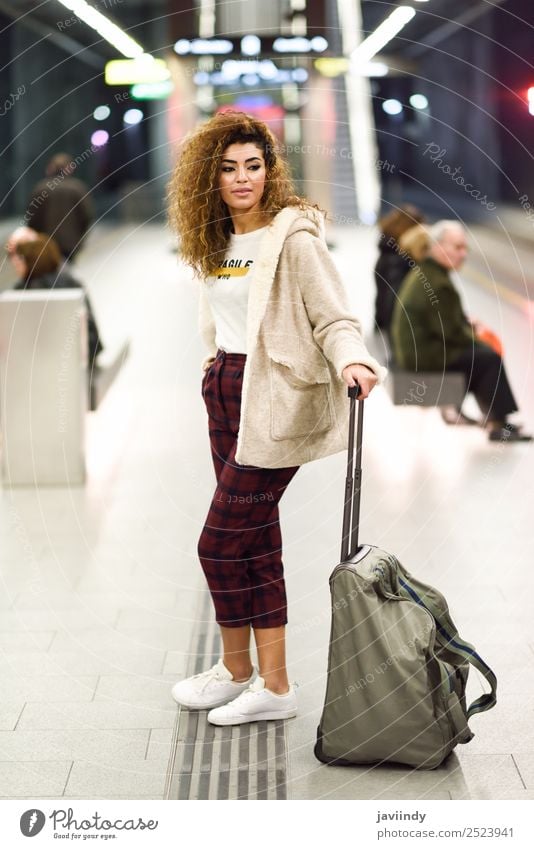 Young Arab woman tourist waiting her train in a subway station Lifestyle Style Vacation & Travel Tourism Trip Human being Young woman Youth (Young adults) Woman