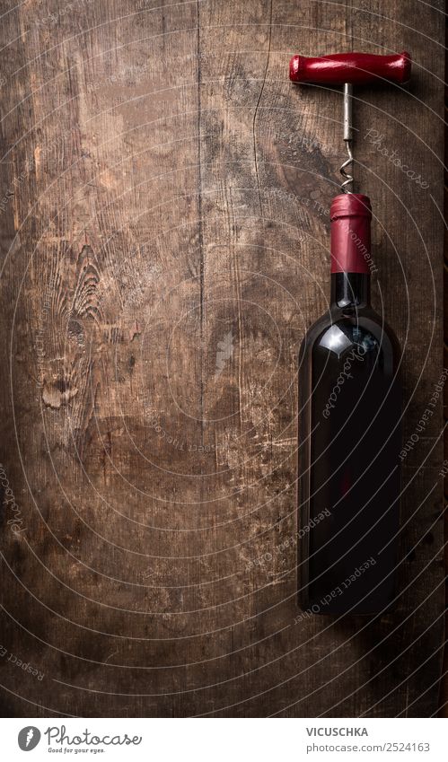 Red wine bottle with corkscrew on wooden background Beverage Alcoholic drinks Wine Shopping Style Design Party Event Restaurant Bar Cocktail bar Business