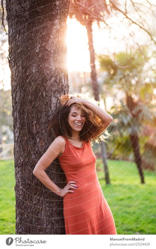 cheerful black afro woman outdoors Lifestyle Joy Happy Beautiful Face Leisure and hobbies Freedom Summer Sun Human being Woman Adults Nature Tree Grass Park