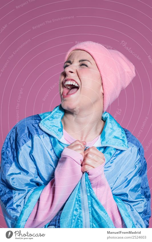 young woman doing facial expressions against a pink background Joy Happy Beautiful Entertainment Human being Woman Adults Art Dancer Fashion Smiling