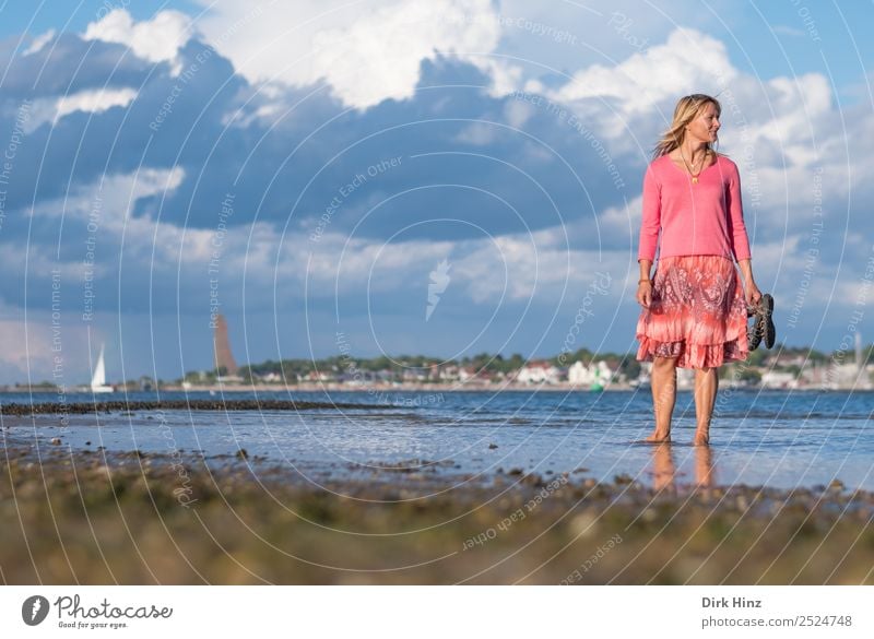 Woman standing in the Kieler Förde with view to the side Vacation & Travel Tourism Far-off places Summer Summer vacation Beach Ocean Human being Feminine Adults