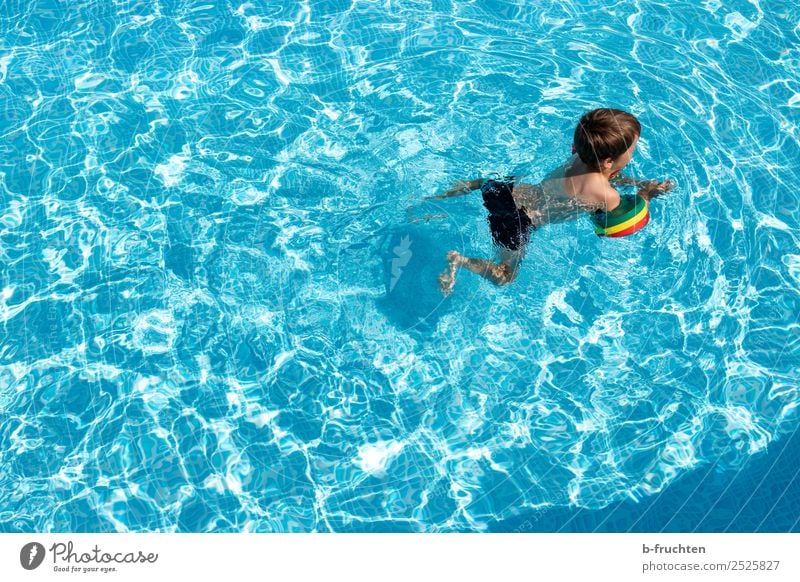 Child with swimming hoop in pool Life Swimming pool Swimming & Bathing Leisure and hobbies Vacation & Travel Freedom Summer Water Study Fresh Healthy Blue