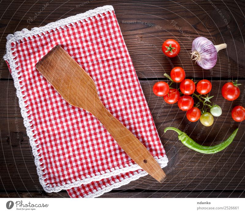 wooden spatula on a red textile towel Vegetable Herbs and spices Nutrition Vegetarian diet Diet Spoon Kitchen Wood Eating Fresh Small Above Juicy Green Red